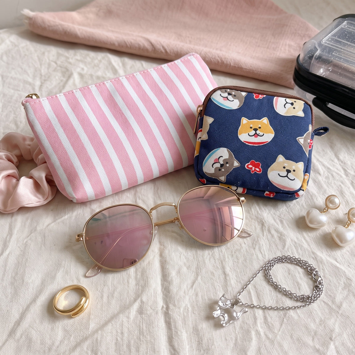 Ultra Rare finds: a striped pouch, a cat coin purse and pink mirrored sunglasses