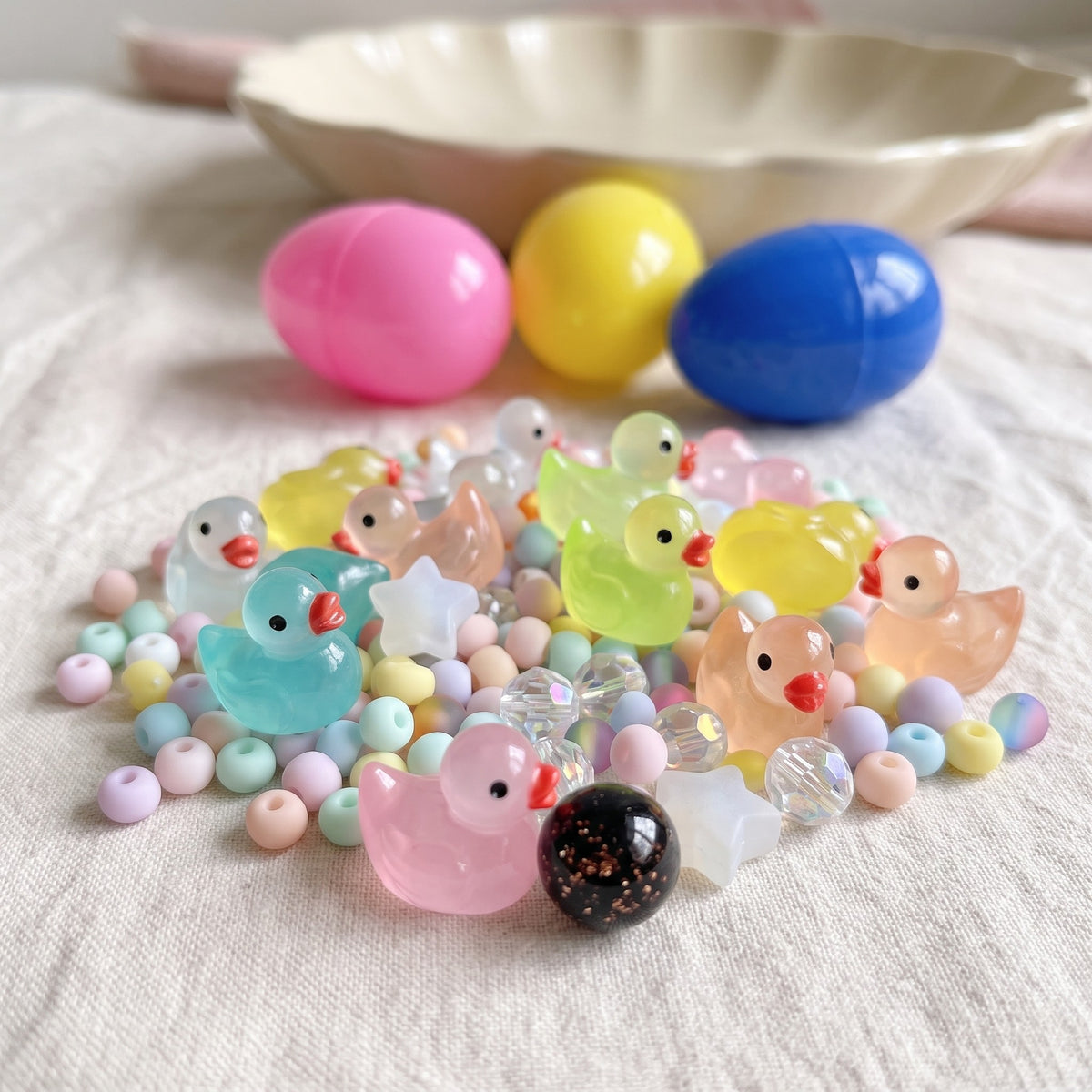 Close up of the little glow ducks, glass beads and the lucky bead